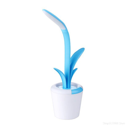 A blue cyan white VP4 Flowerpot Table Lamp with a stylish and unique shape.