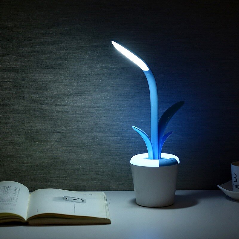 A blue portable VP9 Flowerpot Table Lamp in a cozy and stylish design with a USB charging cable.