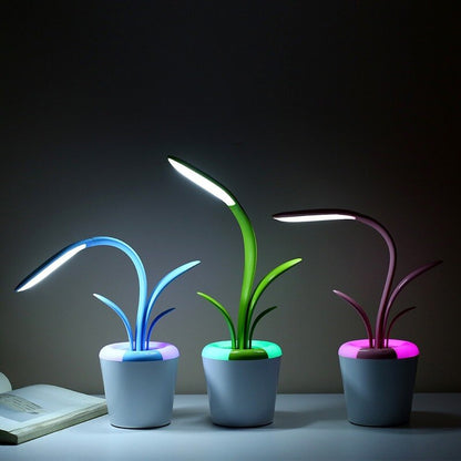 A beautiful blue green magenta Flowerpot Table Lamp with a matching fabric colored cord and downward illumination.